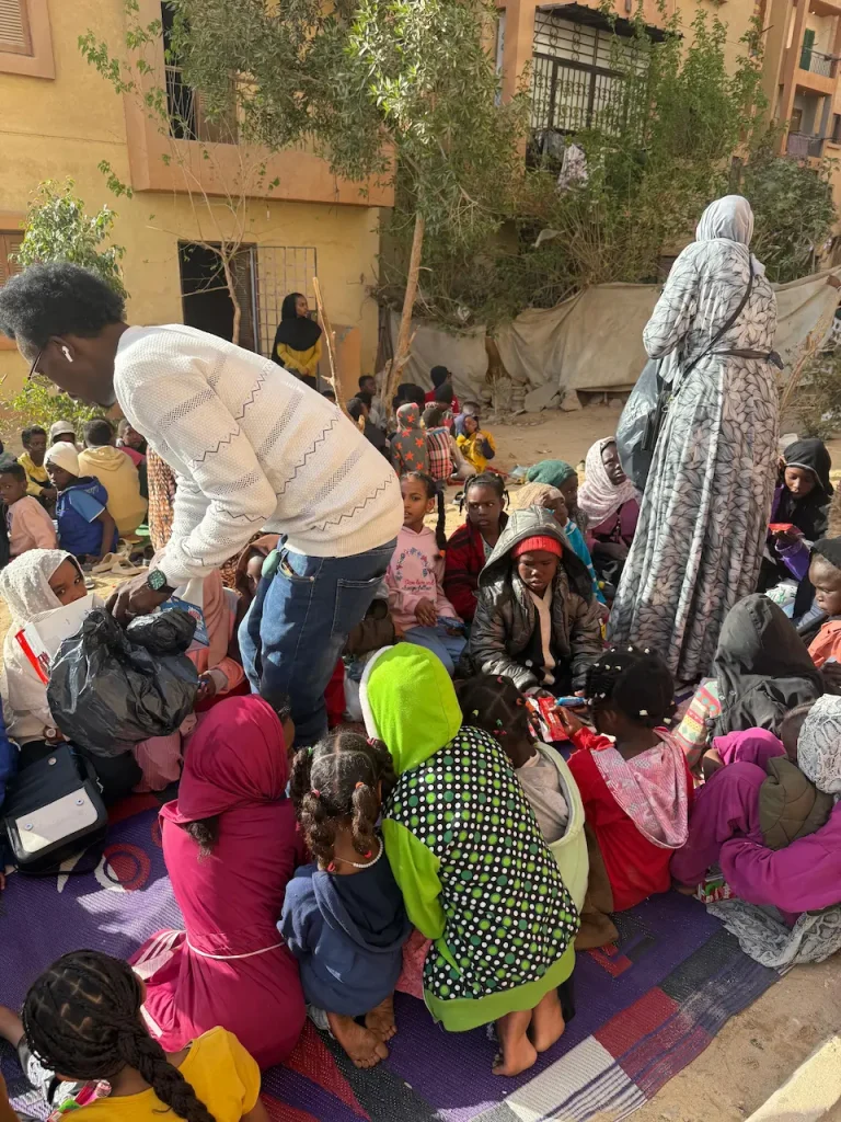 Food aid being distributed to parentless children in Cairo. 
